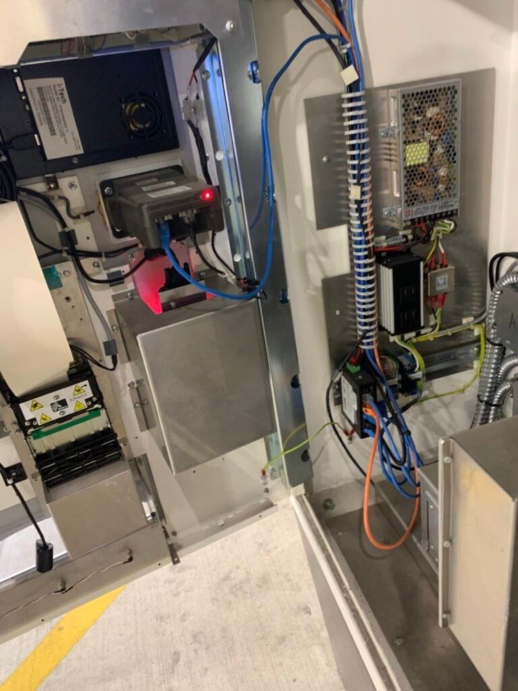 Parking access and revenue control system cabinet with lane controller wiring