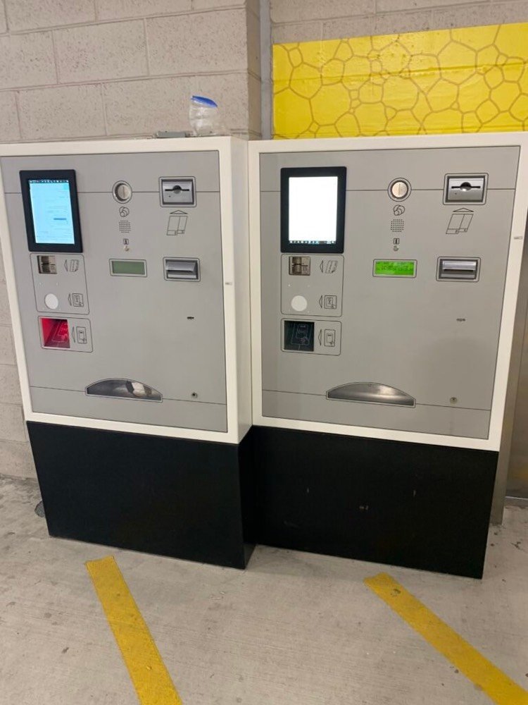 Two pay-on-foot parking pay stations installed in a parking garage by Kyosis
