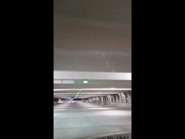Parking guidance system with ceiling-hung LED indicators at the Colgate Technology Campus